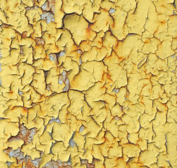 Close-up detail of cracked yellow paint