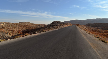 Straight road in the desertic landscape of Mount Lebanon in summer, Faraya, Lebanon
