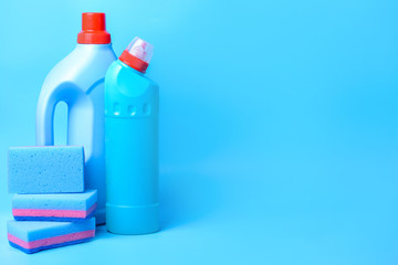 Set of cleaning supplies on color background