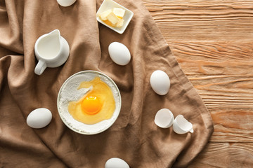 Ingredients for preparing bakery on wooden table