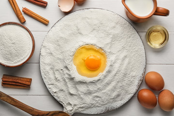 Ingredients for preparing bakery on white wooden table
