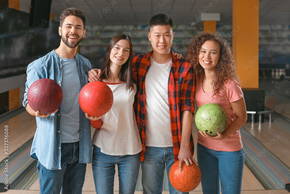 Wall mural happy friends in bowling club