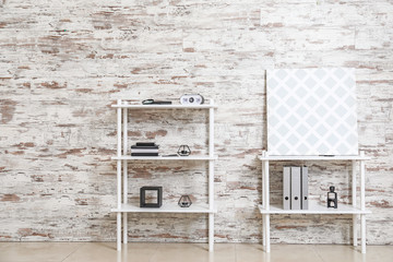 Modern shelf units near wooden wall