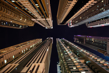 Fototapeta na wymiar Looking up between skyscraper in Dubai