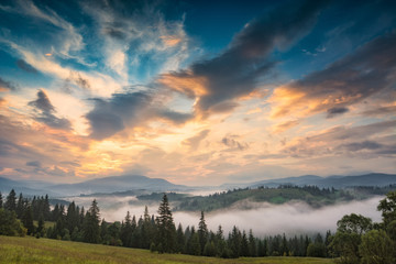 Fototapeta premium Amazing sunset sky over the alpine mountain valley