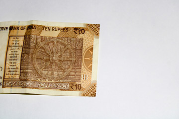 Closeup of New Indian 10 rupee bank note, back side view isolated on white 