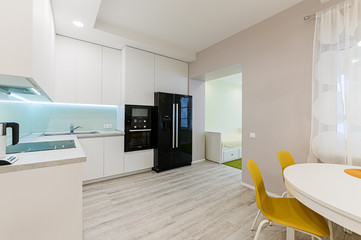 Russia, Moscow- November 04, 2019: interior room apartment modern bright cozy atmosphere. general cleaning, home decoration, preparation of house for sale. kitchen, dining area