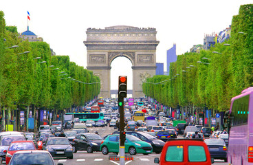 Traffic jam with cars in Paris city, France. view of Arc de Triomphe and Champs Élysees boulevard