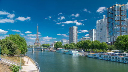 Eiffel tower at the river Seine timelapse from bridge in Paris, France