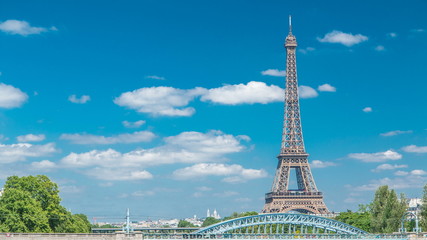 Eiffel tower at the river Seine timelapse from bridge in Paris, France