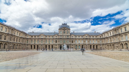 Obraz premium inner yard of louvre with fountain timelapse . Paris, France
