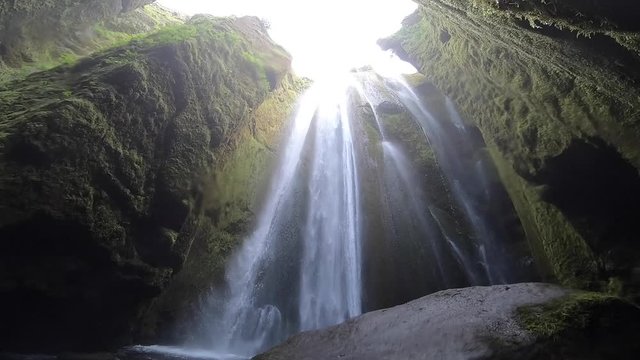 Powerful waterfall Gljufrabui in the cave, slow motion, Iceland