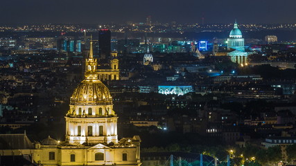 Aerial Night timelapse view of Paris City and Les Invalides shot on the top of Eiffel Tower