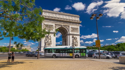 Obraz premium The Arc de Triomphe Triumphal Arch of the Star timelapse is one of the most famous monuments in Paris