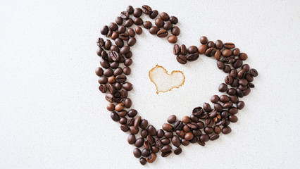 coffee bean in the shape of a heart on a countertop