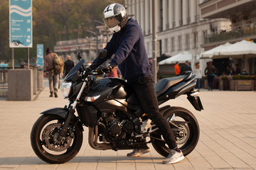 Fototapeta na wymiar Black sports motorcycle close-up on the street.