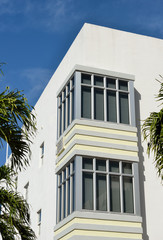 Art Deco Bay Window. Geometric patterns, light colors, white concrete wall.