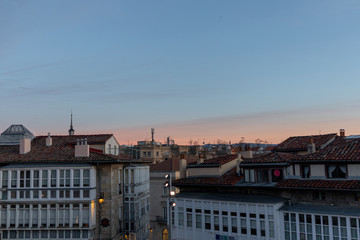 Fototapeta premium Beautiful sunset in orange tones over the rooftops of the city of Vitoria-Gasteiz, Alava, Basque Country, Spain