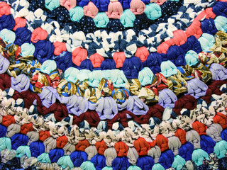 Fototapeta na wymiar Handwork: a carpet of multi-colored shreds of fabric