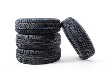 four black tires isolated on white background