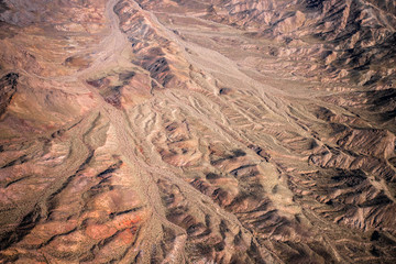 Aerial Photography over western United States with landforms, desert and mountains in view