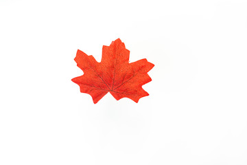 plastic artificial  maple leaf made from fabric isolated on white background