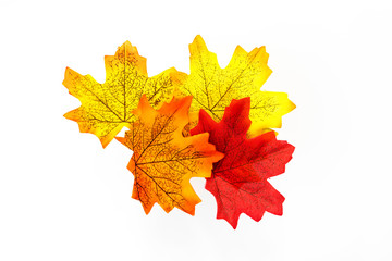 plastic artificial  maple leaf made from fabric isolated on white background