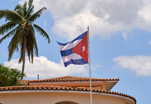 Cuban flag waving on flagpole in Havana