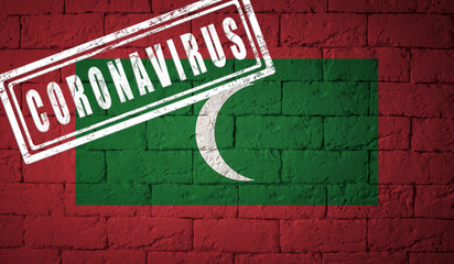 Flag of the Maldives on brick wall texture.