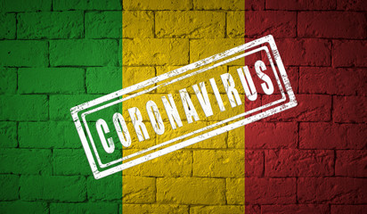 Obraz premium Flag of the Mali on brick wall texture.