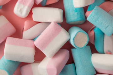 marshmallow candy on pink background, top view