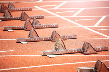 Closeup of start blocks for sprint running track of stadium