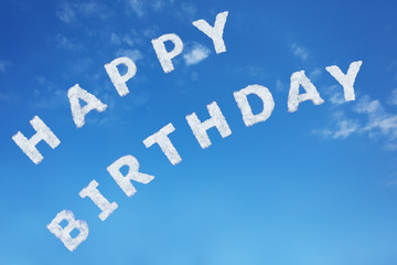 Happy birthday sign text made of clouds letters over clear day blue sky