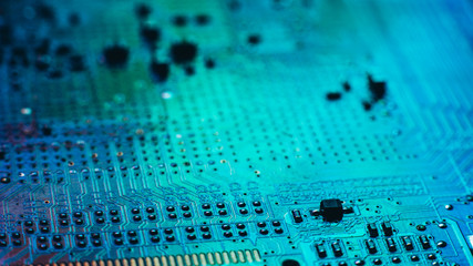 Printed circuit board. Electronic engineering. Turquoise contact pads tracks on PCB.