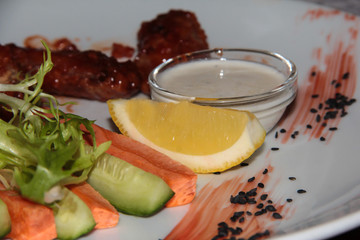 Fresh carrots, cucumber, arugula with lemon and meat.