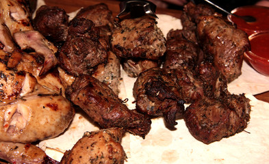 Skewers in spices on pita bread. Juicy chunks of protein.