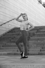 Fitness sporty woman showing her well trained body