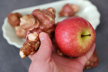 a plate full of Jerusalem artichoke and green and red apples, recommended foods for dieting,
