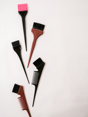hairstyling tools with dye brush on white background