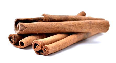 Cinnamon sticks seasoning isolated on white background. Close-up.