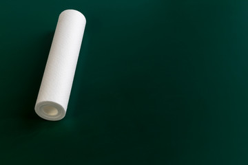 Water filter, cartridge. Close-up. On a wooden background. Copy space.