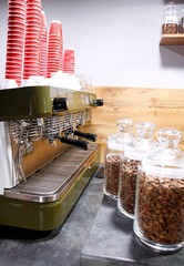 hot coffee and coffee beans on the background of coffee grinders