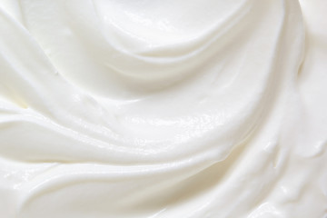 Sour cream, greek yogurt texture. White dairy product swirl closeup. Creamy healthy natural food macro photography. Top view