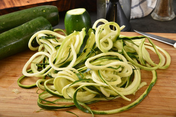 Spiralized zucchini on a cutting board