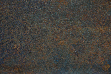 Rusty dark sheet of iron close-up. Texture