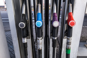 Gas and petrol station. Guns for refueling at a gas station. Detail of a petrol pump different...
