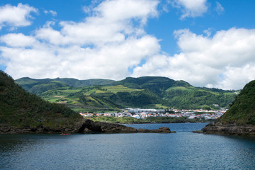 Fototapeta premium View of the beautiful village of Vila Franca do Campo on the island of San Miguel from the volcanic uninhabited island of Vila Franca, Azores, Portugal. Travel to the Azores.