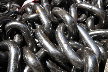 Iron chains close-up. They are unused and have a gray metallic color. He was taken in the store.