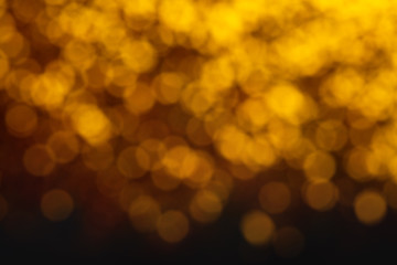 Abstract gold bokeh on black background