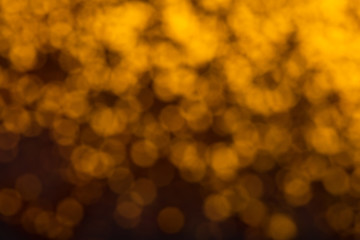 Abstract gold bokeh on black background